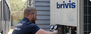 Technician servicing a Brivis heating and cooling unit