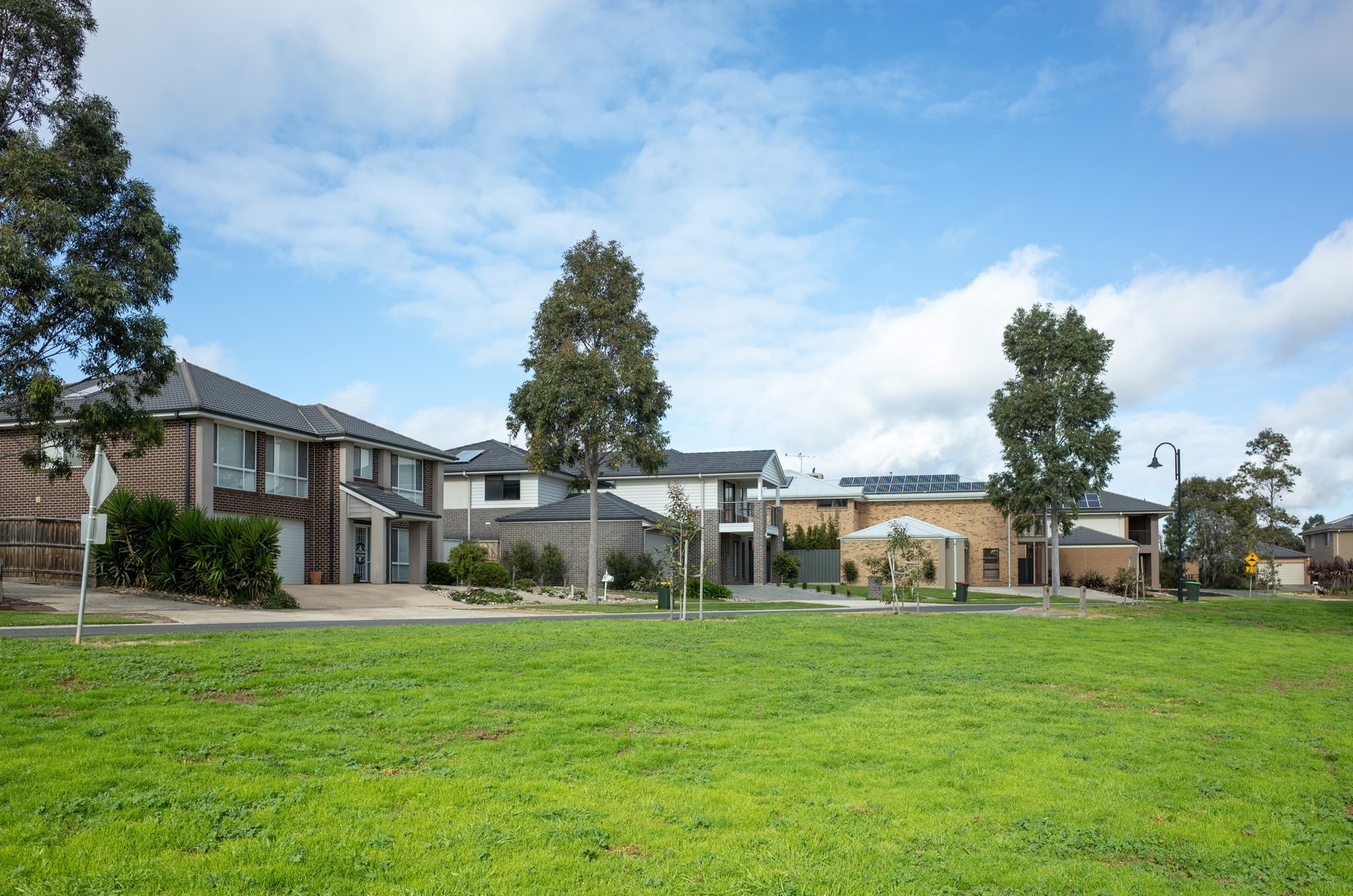 Row of suburban houses beside a park in Melbourne